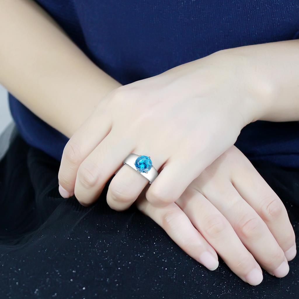 TK52003 - High polished (no plating) Stainless Steel Ring with Synthetic Glass in Sea Blue